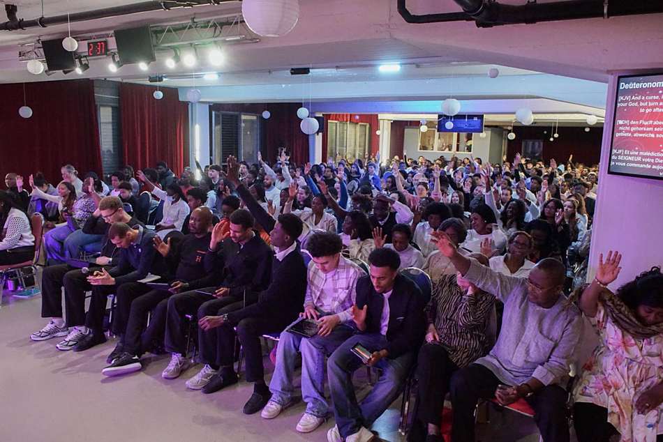 Hands raised during a Sunday service