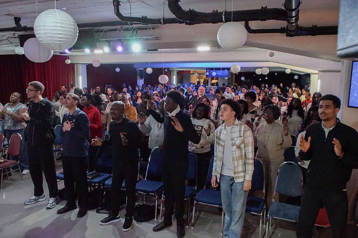 The congregation standing in worship
